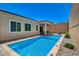 Inviting pool with adjacent covered patio for relaxing and entertaining in the backyard at 8525 Stokestone St, Las Vegas, NV 89166