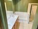 Bathroom with double sink vanity and tiled shower-tub combination at 8777 W Maule Ave # 2167, Las Vegas, NV 89148
