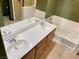 Bathroom with dual sinks and bathtub at 8777 W Maule Ave # 2167, Las Vegas, NV 89148