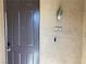 Entryway showcasing the front door, stylish lighting fixture, and unit number at 8777 W Maule Ave # 2167, Las Vegas, NV 89148