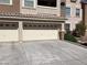 Attached garage with a three-car driveway and well-maintained landscaping at 8777 W Maule Ave # 2167, Las Vegas, NV 89148