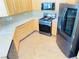 Well-equipped kitchen featuring stainless steel appliances, light wood cabinets, and a stylish wood-look floor at 8777 W Maule Ave # 2167, Las Vegas, NV 89148