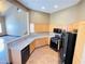 Well-lit kitchen boasts light wood cabinetry, modern appliances, and an open layout at 8777 W Maule Ave # 2167, Las Vegas, NV 89148