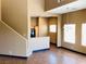 Bright living room with hardwood floors, large windows, and a modern chandelier at 8777 W Maule Ave # 2167, Las Vegas, NV 89148