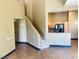 Inviting living room showcasing an open floor plan, stairs, and an adjacent kitchen area at 8777 W Maule Ave # 2167, Las Vegas, NV 89148