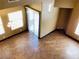 Living room showcasing a sliding glass door and rich hardwood flooring at 8777 W Maule Ave # 2167, Las Vegas, NV 89148