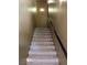 Carpeted staircase leading up to the next level, enhanced by modern lighting at 8777 W Maule Ave # 2167, Las Vegas, NV 89148