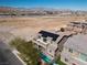 An aerial view showing the property, pool, solar panels, and surrounding desert landscape at 8895 Dartmouth Grove Ave, Las Vegas, NV 89148