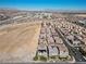 Expansive aerial view of a well-planned community with desert landscaping, offering a serene living environment at 8895 Dartmouth Grove Ave, Las Vegas, NV 89148