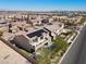 An aerial view showcasing the property, solar panels, pool, and lush backyard landscaping at 8895 Dartmouth Grove Ave, Las Vegas, NV 89148