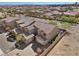 Overhead shot of home displaying desert landscaping, brick driveway, and a two-car garage at 8895 Dartmouth Grove Ave, Las Vegas, NV 89148