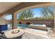 Inviting backyard oasis featuring a refreshing pool, soothing hot tub, and cozy fire pit for outdoor relaxation at 8895 Dartmouth Grove Ave, Las Vegas, NV 89148