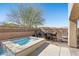 Backyard with a spa, patio dining, barbecue grill and a cozy ambiance for outdoor gatherings at 8895 Dartmouth Grove Ave, Las Vegas, NV 89148