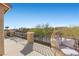 Relaxing balcony view with patio furniture, overlooking serene neighborhood scenery and a clear blue sky at 8895 Dartmouth Grove Ave, Las Vegas, NV 89148