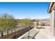 Balcony with outdoor seating overlooking desert landscaping and mountain views at 8895 Dartmouth Grove Ave, Las Vegas, NV 89148