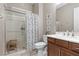 Well-lit bathroom with a glass-enclosed shower and a vanity with ample counter space at 8895 Dartmouth Grove Ave, Las Vegas, NV 89148