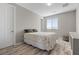 Cozy bedroom featuring a patterned rug and a window with natural light at 8895 Dartmouth Grove Ave, Las Vegas, NV 89148