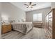 Comfortable bedroom with a queen bed, soft lighting, and ample storage space at 8895 Dartmouth Grove Ave, Las Vegas, NV 89148
