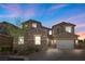 Charming two-story home boasts a stone accent, attached two car garage and a beautifully landscaped front yard at 8895 Dartmouth Grove Ave, Las Vegas, NV 89148