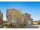 Charming two-story home boasts a stone accent, attached one car garage and a beautifully landscaped front yard at 8895 Dartmouth Grove Ave, Las Vegas, NV 89148