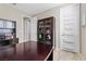 Functional home office features a large desk, display cabinet, and convenient storage solutions at 8895 Dartmouth Grove Ave, Las Vegas, NV 89148