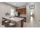 Well-lit kitchen with stainless steel appliances, sleek countertops, and a bar-style seating area at 8895 Dartmouth Grove Ave, Las Vegas, NV 89148