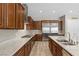 A spacious kitchen featuring stainless steel appliances, granite countertops, and plenty of cabinet space at 8895 Dartmouth Grove Ave, Las Vegas, NV 89148