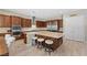 Modern kitchen with a large island, stainless steel appliances, granite countertops, and custom wood cabinets at 8895 Dartmouth Grove Ave, Las Vegas, NV 89148