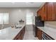 Modern kitchen with granite countertops, stainless steel appliances, and ample cabinet space at 8895 Dartmouth Grove Ave, Las Vegas, NV 89148