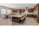 Gourmet kitchen featuring a center island with seating, stainless steel appliances, and custom cabinetry at 8895 Dartmouth Grove Ave, Las Vegas, NV 89148