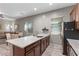 Bright kitchen area featuring granite countertops, stainless steel appliances, and views to the dining area at 8895 Dartmouth Grove Ave, Las Vegas, NV 89148