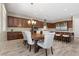 A well-equipped kitchen with an island, stainless steel appliances, and an adjacent dining area at 8895 Dartmouth Grove Ave, Las Vegas, NV 89148