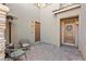Private outdoor patio features a charming seating area with custom furniture and pavers at 8895 Dartmouth Grove Ave, Las Vegas, NV 89148