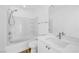 Bright bathroom with a shower-tub combo, white tiling, and a vanity at 9017 Becoming Ct, Las Vegas, NV 89149