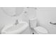 Bathroom featuring a modern sink, toilet, and an oval mirror at 9017 Becoming Ct, Las Vegas, NV 89149