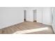 Bright bedroom featuring hardwood floors and a walk-in closet at 9017 Becoming Ct, Las Vegas, NV 89149