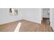 Bright bedroom featuring hardwood floors, white walls, and natural light at 9017 Becoming Ct, Las Vegas, NV 89149