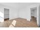 Bright bedroom featuring hardwood floors and a large walk-in closet at 9017 Becoming Ct, Las Vegas, NV 89149