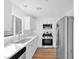 Bright kitchen featuring stainless steel appliances, white cabinets, and ample counter space at 9017 Becoming Ct, Las Vegas, NV 89149