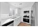 Modern kitchen equipped with stainless steel appliances, white cabinets, and stylish countertops at 9017 Becoming Ct, Las Vegas, NV 89149