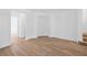 Inviting room with wood flooring, featuring a built-in alcove and access to a staircase at 9017 Becoming Ct, Las Vegas, NV 89149