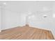 Spacious living room featuring stylish wood floors and ample natural light from well-placed windows at 9017 Becoming Ct, Las Vegas, NV 89149