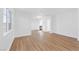 Bright living room showcasing wood floors, recessed lighting and a seamless flow into the adjacent rooms at 9017 Becoming Ct, Las Vegas, NV 89149