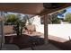 Cozy patio space featuring palm trees and rock landscaping at 9420 Water Flow Ct, Las Vegas, NV 89134