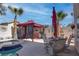 Inviting outdoor space featuring a covered patio, outdoor dining, and refreshing pool at 9680 Granite Gorge Ct, Las Vegas, NV 89148