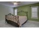 Bedroom featuring a metal frame bed, ceiling fan, and plantation shutters on the windows at 9680 Granite Gorge Ct, Las Vegas, NV 89148