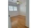 Bedroom features hardwood floor and shuttered windows at 9680 Granite Gorge Ct, Las Vegas, NV 89148