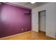 A purple bedroom features hardwood floors, window with blinds, a ceiling fan and walk-in closet at 9680 Granite Gorge Ct, Las Vegas, NV 89148