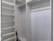 A well-organized walk-in closet with ample shelving, rods for hanging and storage space at 9680 Granite Gorge Ct, Las Vegas, NV 89148