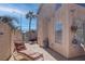 Side yard view featuring a lounge chair and access to the backyard area at 9680 Granite Gorge Ct, Las Vegas, NV 89148